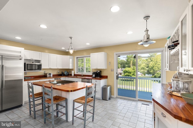 21 Heisler Ave, Charlestown, MD 21914 - kitchen with wooden counters, stainless steel appliances, a sink, white cabinetry, and recessed lighting
