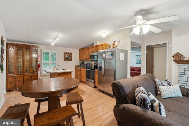 473 Cumberland Rd, Oakland, MD 21550 - kitchen with a ceiling fan, light countertops, a sink, light wood-style floors, and stainless steel appliances