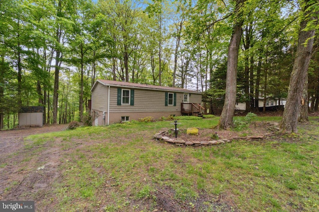 473 Cumberland Rd, Oakland, MD 21550 - exterior space with a storage unit and an outbuilding