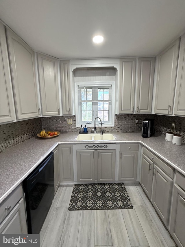 18 River Ln, Levittown, PA 19055 - kitchen with a sink, dishwasher, and backsplash