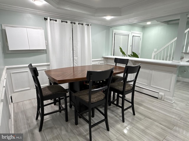 18 River Ln, Levittown, PA 19055 - dining room featuring a decorative wall, crown molding, a baseboard heating unit, light wood finished floors, and stairs