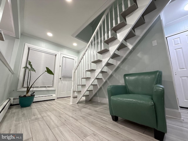 18 River Ln, Levittown, PA 19055 - sitting room featuring stairs, crown molding, wood finished floors, baseboards, and a decorative wall