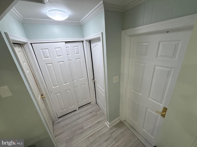 18 River Ln, Levittown, PA 19055 - hallway featuring ornamental molding, wood tiled floors, and baseboards