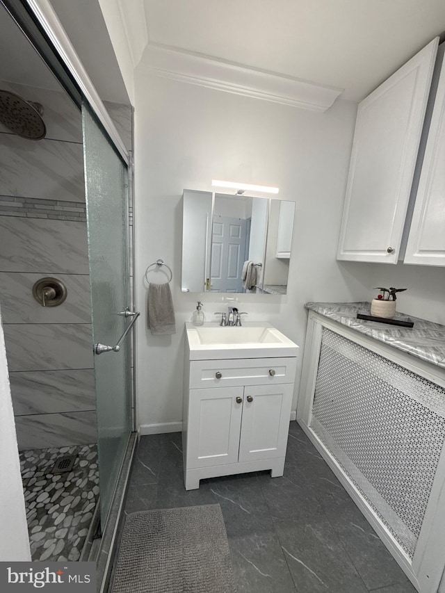 18 River Ln, Levittown, PA 19055 - bathroom featuring a shower stall, vanity, crown molding, and baseboards