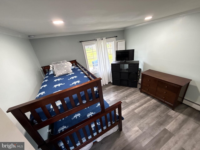18 River Ln, Levittown, PA 19055 - bedroom with crown molding, wood finished floors, and baseboard heating