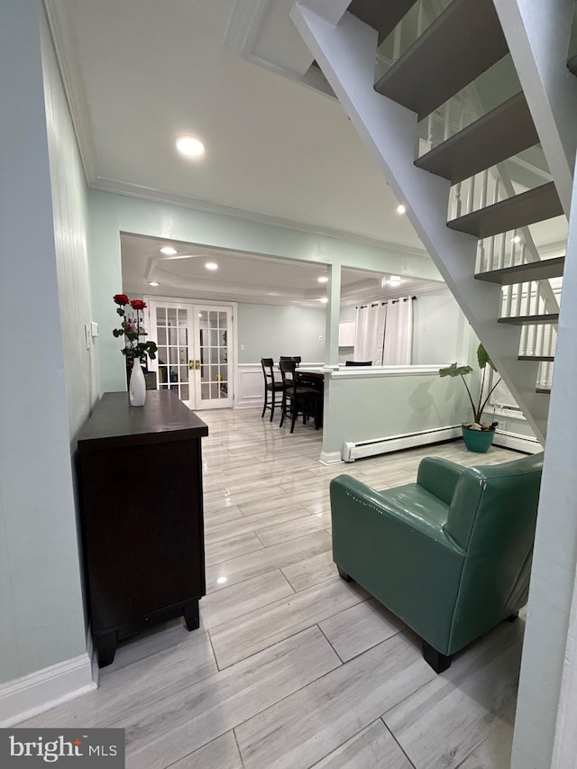 18 River Ln, Levittown, PA 19055 - living area with a baseboard radiator, ornamental molding, french doors, stairway, and recessed lighting