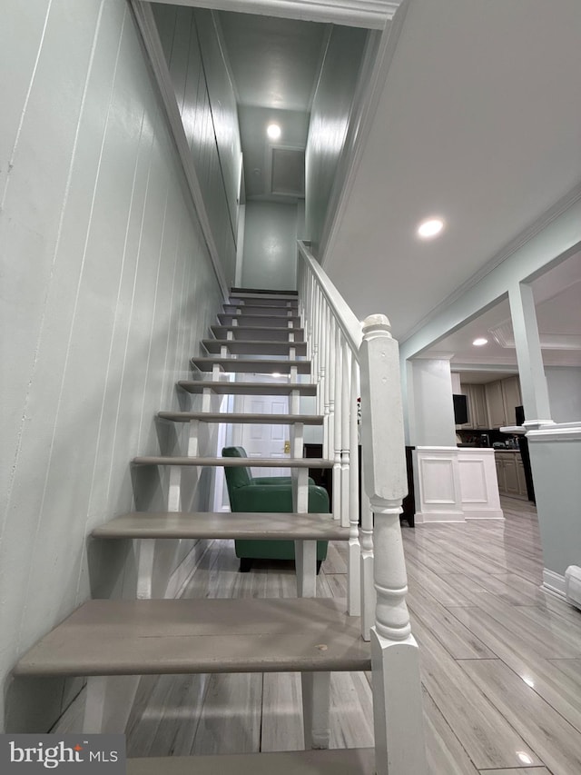 18 River Ln, Levittown, PA 19055 - stairs featuring wood finished floors, recessed lighting, and a decorative wall
