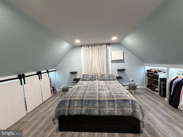 18 River Ln, Levittown, PA 19055 - bedroom featuring wood finished floors, lofted ceiling, baseboards, and recessed lighting