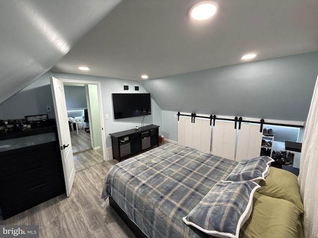 18 River Ln, Levittown, PA 19055 - bedroom featuring wood finished floors, lofted ceiling, baseboards, and recessed lighting