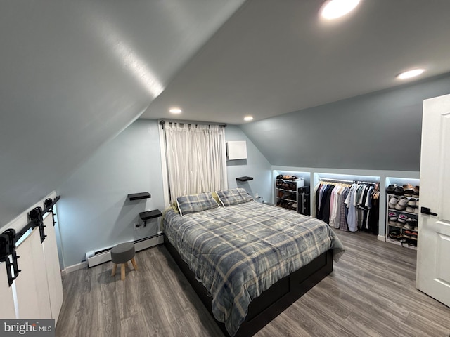 18 River Ln, Levittown, PA 19055 - bedroom with baseboards, wood finished floors, lofted ceiling, a barn door, and recessed lighting