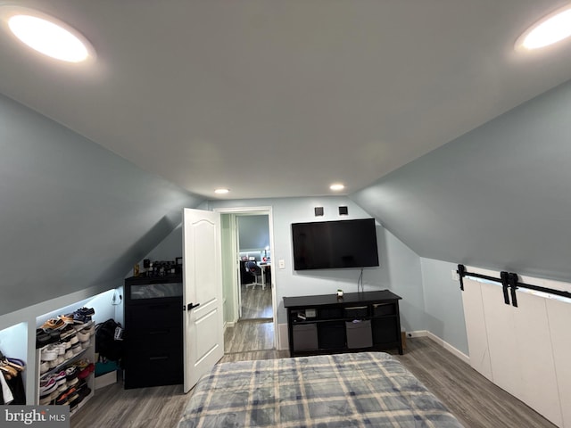 18 River Ln, Levittown, PA 19055 - bonus room featuring wood finished floors, lofted ceiling, recessed lighting, baseboards, and a barn door