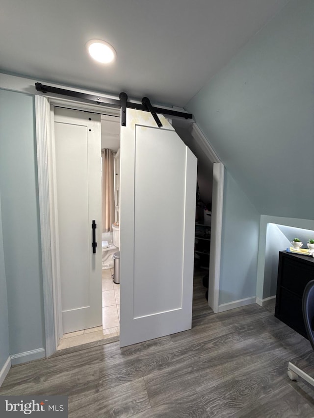 18 River Ln, Levittown, PA 19055 - bonus room with wood finished floors, a barn door, and baseboards