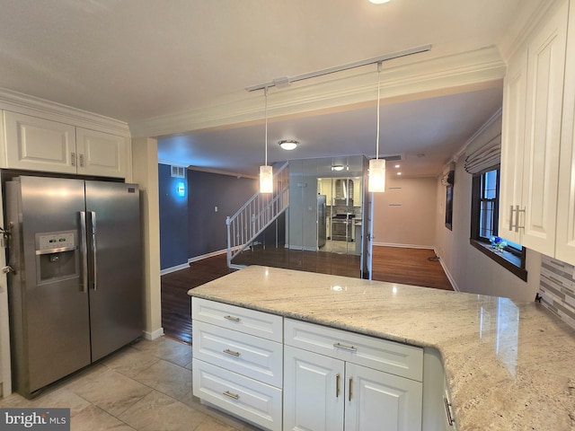 102 Suburban Ter, Stratford, NJ 08084 - kitchen featuring stainless steel refrigerator with ice dispenser, white cabinetry, ornamental molding, light stone countertops, and pendant lighting