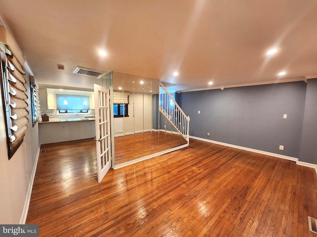 102 Suburban Ter, Stratford, NJ 08084 - below grade area with hardwood / wood-style floors, stairway, and recessed lighting