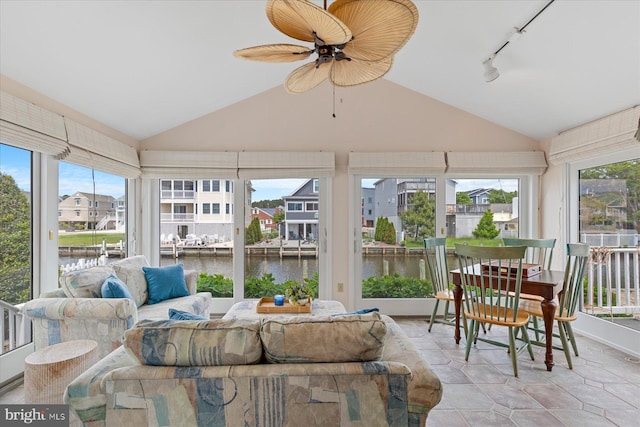 113 Henlopen Dr, South Bethany, DE 19930 - sunroom featuring lofted ceiling, a water view, track lighting, a residential view, and tile patterned floors