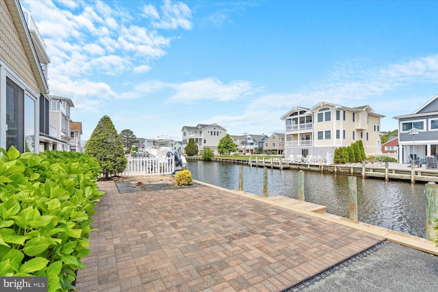 113 Henlopen Dr, South Bethany, DE 19930 - dock area featuring a water view, a residential view, and fence