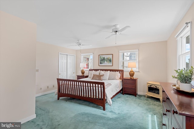 113 Henlopen Dr, South Bethany, DE 19930 - carpeted bedroom with baseboards, a closet, and a ceiling fan