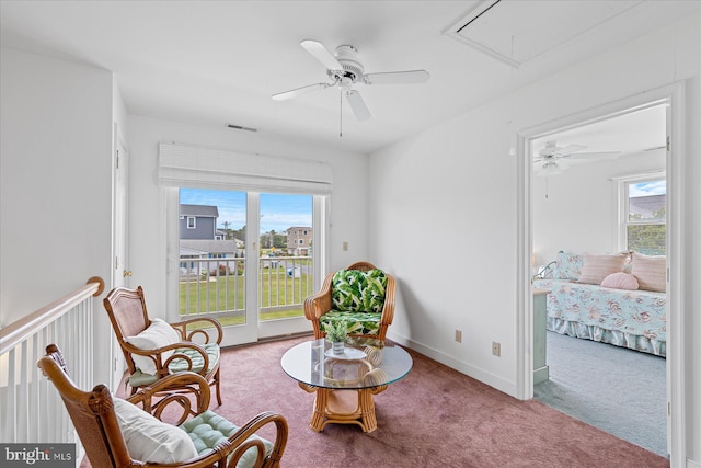 113 Henlopen Dr, South Bethany, DE 19930 - living area with attic access, carpet floors, ceiling fan, and plenty of natural light