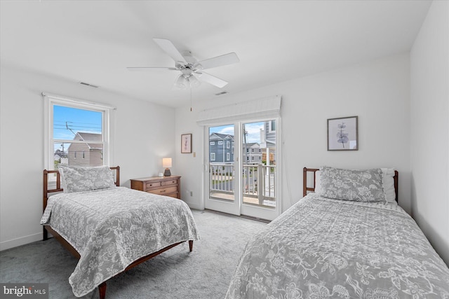113 Henlopen Dr, South Bethany, DE 19930 - carpeted bedroom with access to outside, multiple windows, and ceiling fan