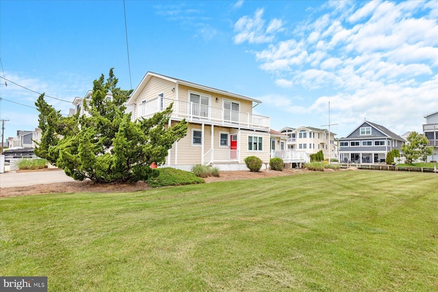 113 Henlopen Dr, South Bethany, DE 19930 - view of front of property with a balcony, a front yard, and a residential view