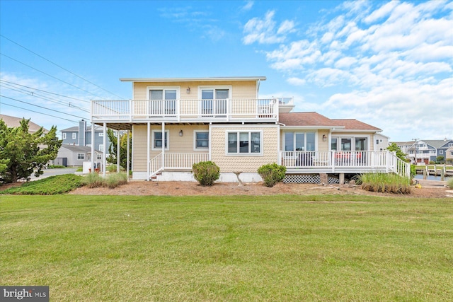 113 Henlopen Dr, South Bethany, DE 19930 - back of house featuring a yard, a balcony, and a wooden deck