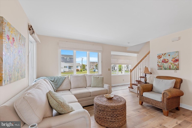 113 Henlopen Dr, South Bethany, DE 19930 - living area with light wood finished floors, stairway, and baseboards