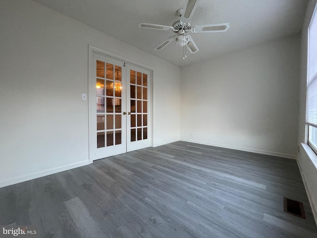 409 Connecticut Ave, Norfolk, VA 23508 - empty room with french doors, visible vents, dark wood finished floors, ceiling fan, and baseboards
