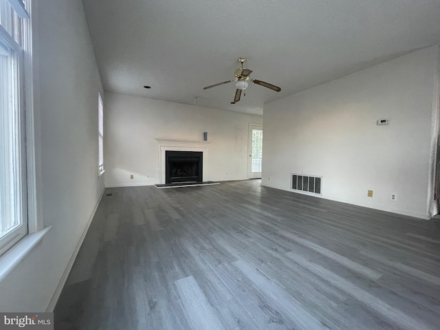 409 Connecticut Ave, Norfolk, VA 23508 - unfurnished living room featuring a ceiling fan, baseboards, visible vents, wood finished floors, and a fireplace