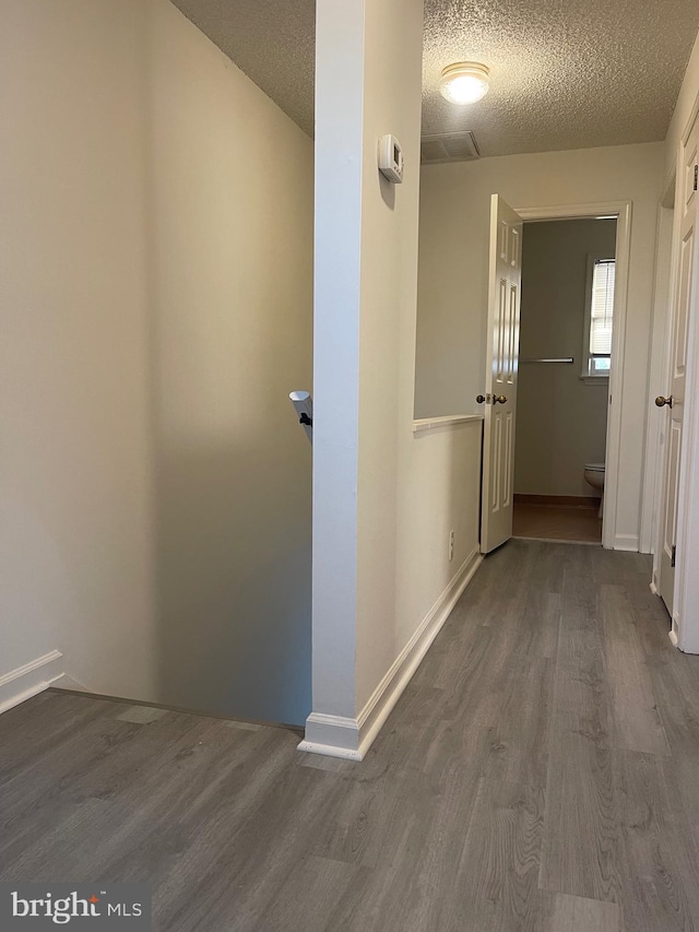 409 Connecticut Ave, Norfolk, VA 23508 - hallway featuring baseboards, a textured ceiling, and dark wood-type flooring