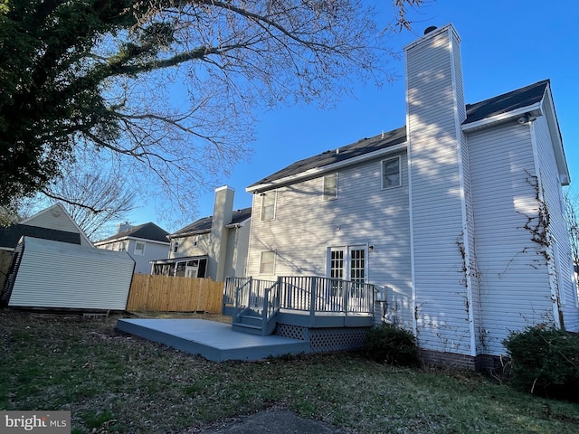 409 Connecticut Ave, Norfolk, VA 23508 - rear view of house with fence, a patio area, a wooden deck, and a chimney