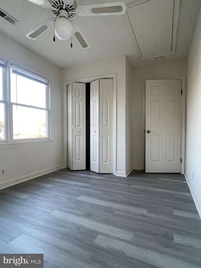 409 Connecticut Ave, Norfolk, VA 23508 - unfurnished bedroom featuring a closet, attic access, baseboards, visible vents, and wood finished floors