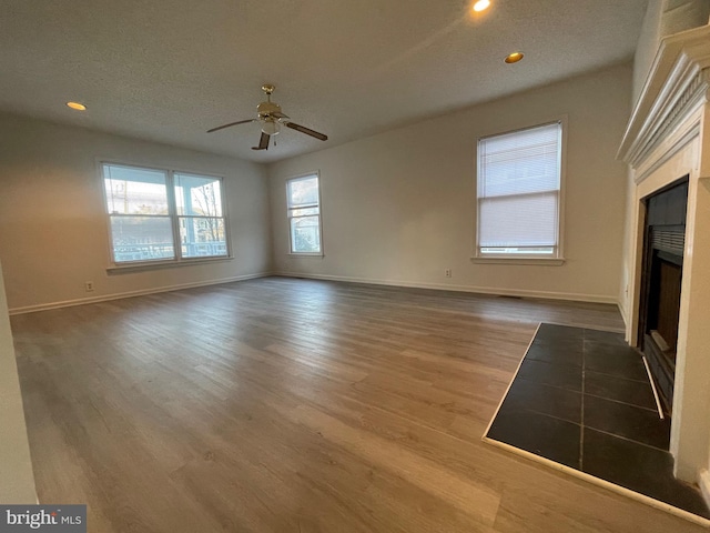 409 Connecticut Ave, Norfolk, VA 23508 - unfurnished living room with recessed lighting, baseboards, ceiling fan, a fireplace with flush hearth, and wood finished floors