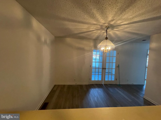 409 Connecticut Ave, Norfolk, VA 23508 - unfurnished dining area featuring baseboards, an inviting chandelier, and wood finished floors