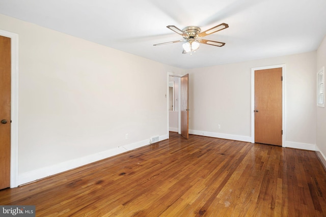 unfurnished bedroom with wood-type flooring, baseboards, and ceiling fan