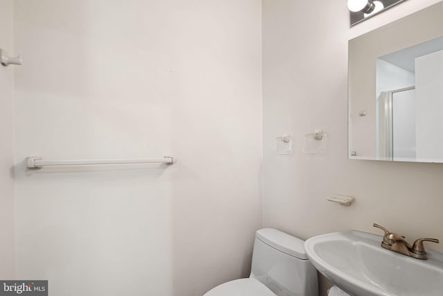 bathroom featuring a sink and toilet
