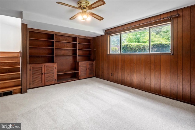 8815 Beauchamp Dr, Alexandria, VA 22309 - unfurnished room with wood walls, ceiling fan, built in features, carpet flooring, and baseboards