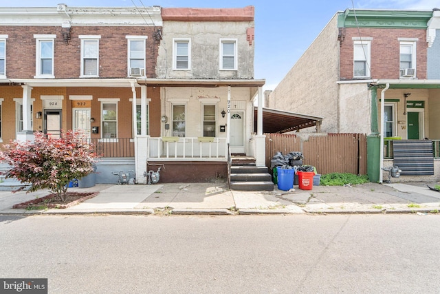 920 Cedar St, Camden, NJ 08102 - townhome / multi-family property with covered porch, fence, and brick siding