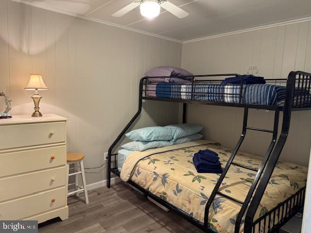 11 71st St Unit 102, Ocean City, MD 21842 - bedroom featuring wood finished floors, crown molding, and baseboards