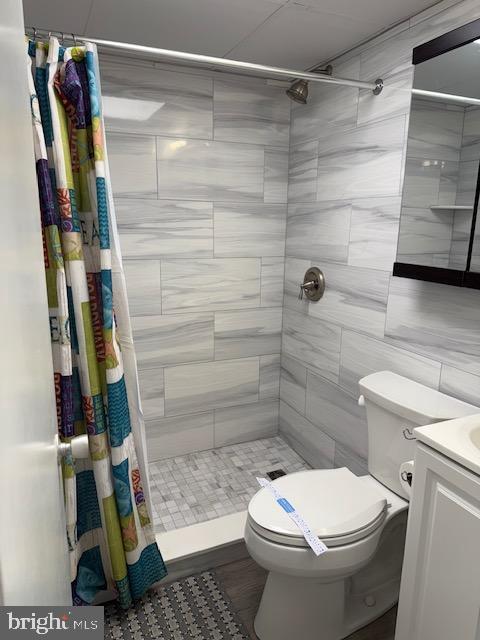 11 71st St Unit 102, Ocean City, MD 21842 - full bath with a stall shower, toilet, and vanity