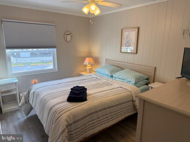 11 71st St Unit 102, Ocean City, MD 21842 - bedroom with wood finished floors, ornamental molding, and a ceiling fan