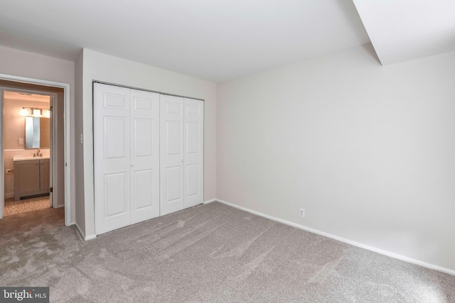 3712 N Rosser St Unit 201, Alexandria, VA 22311 - unfurnished bedroom featuring carpet, baseboards, and a closet