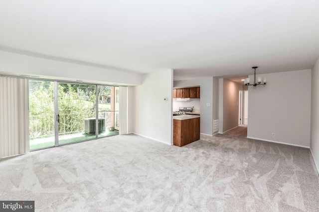 3712 N Rosser St Unit 201, Alexandria, VA 22311 - unfurnished living room with a chandelier, light carpet, and baseboards