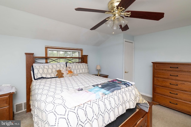 bedroom featuring lofted ceiling, ceiling fan, light carpet, and visible vents