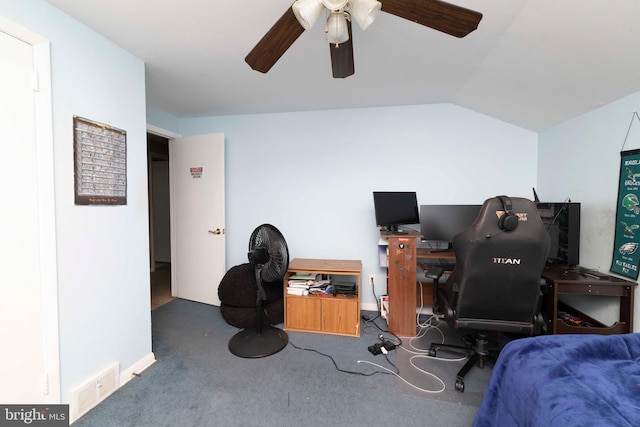carpeted office featuring a ceiling fan, lofted ceiling, and visible vents