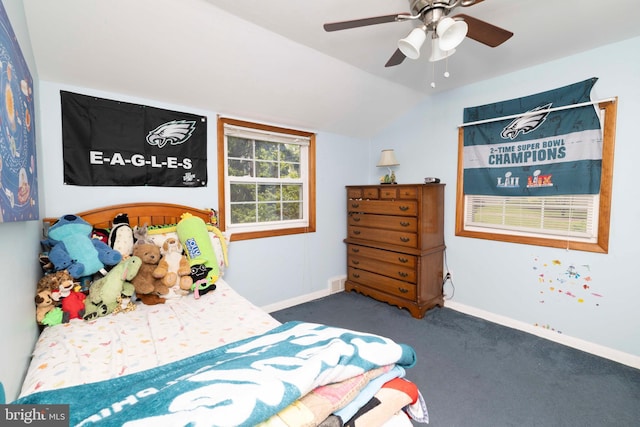bedroom featuring carpet, vaulted ceiling, baseboards, and ceiling fan