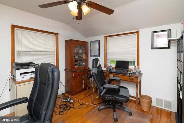 office area featuring visible vents, wood finished floors, a ceiling fan, and lofted ceiling