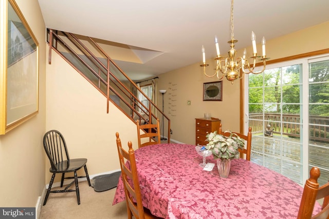 dining area with carpet flooring, an inviting chandelier, baseboards, and stairs