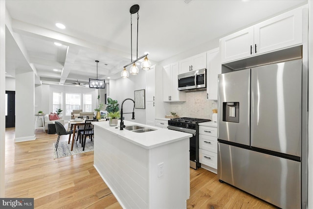 2424 W Lanvale St, Baltimore, MD 21216 - kitchen featuring stainless steel appliances, a sink, recessed lighting, coffered ceiling, and white cabinets