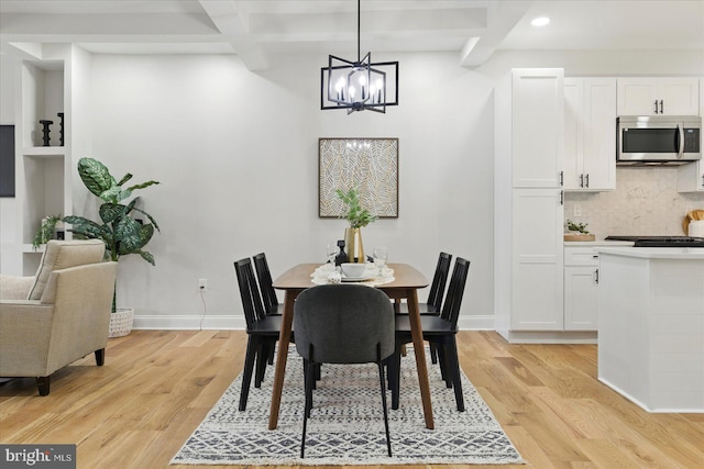 2424 W Lanvale St, Baltimore, MD 21216 - dining area with beam ceiling, light wood-type flooring, a chandelier, coffered ceiling, and recessed lighting