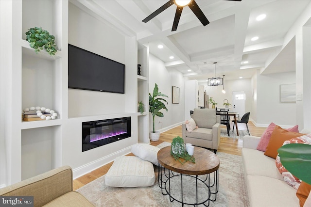 2424 W Lanvale St, Baltimore, MD 21216 - living area with wood finished floors, beamed ceiling, ceiling fan, built in shelves, and recessed lighting